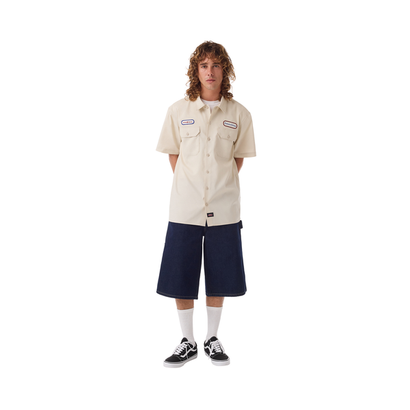 lifestyle photo of man wearing genuine dickies nitro circus work shirt